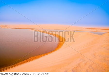 Desert At Sunrise, Golden Hue And Layered Almost Abstract Colors Before The Sun Rises Over Sealine D