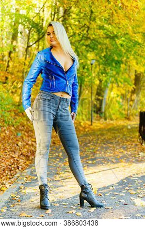Sensual Woman Wearing Fashionable Outfit. Female Having Navy Bue Leather Jacket, Jeans And High Knee