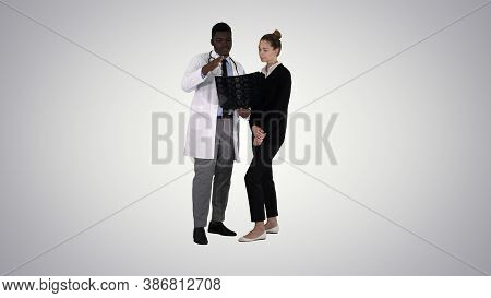 Young Woman Visiting Radiologist For X-ray Exam Of Her Brain On