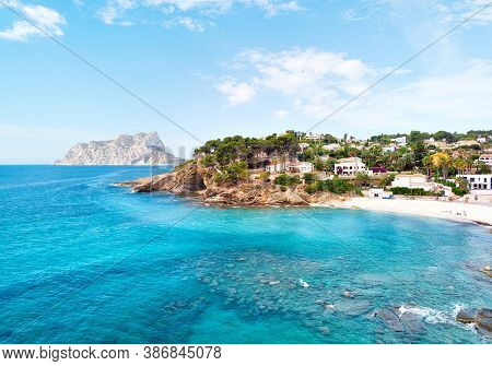 Turquoise Bay Of Mediterranean Sea Of Benissa Spanish Resort Town. White Sand On The Beach, Hillside