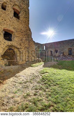 Grassy Court Of The Medieval Castle Against The Sun With Glare Effects