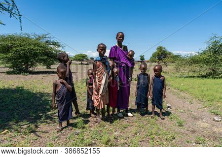 Engare Sero. Tanzania - January 2020: Indigenous Maasai In Traditional Village. Maasailand Is The Ar