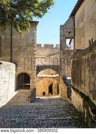 The Stone Walls And The Tower Of The Famous Caetani Castle Of Sermoneta, Little Medieval Town In The