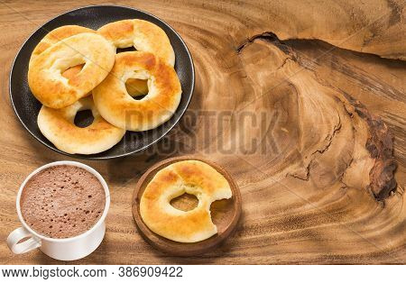 Pandequeso Traditional Colombian Food - Hot Drink Chocolate. Wood Background