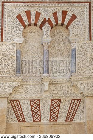 Great Mosque Of Cordoba Outdoors Decoration Detail. Window With Latticework At San Jose Door. Andalu