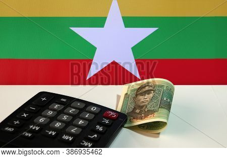 One Of Banknote Currency Myanmar Kyats With Calculator On The White Floor With The Union Of Myanmar 