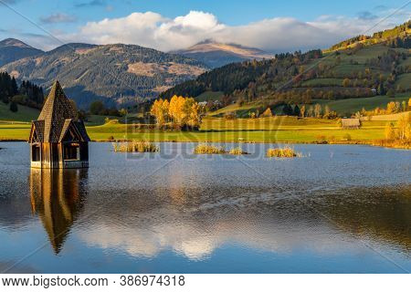 autumn pond under the mountains, Murau district,
Styria, Austria