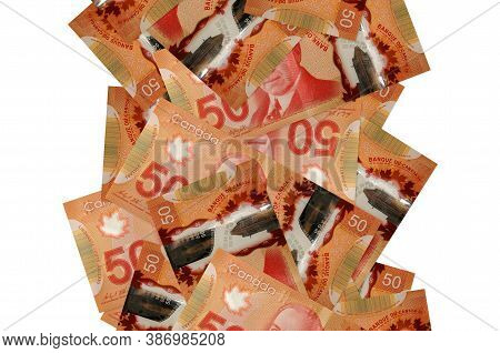 50 Canadian Dollars Bills Flying Down Isolated On White. Many Banknotes Falling With White Copyspace