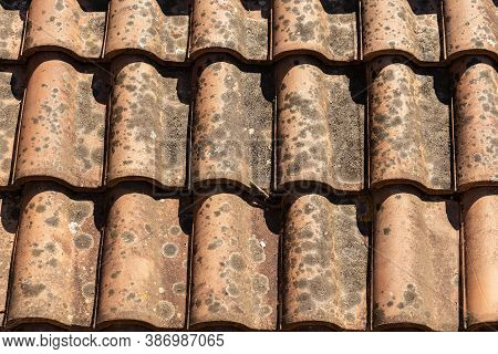 Pantiles. Closeup Of An Old And Dirty Roof With Tiles Made From Clay Or Terracotta (coppo In Italian