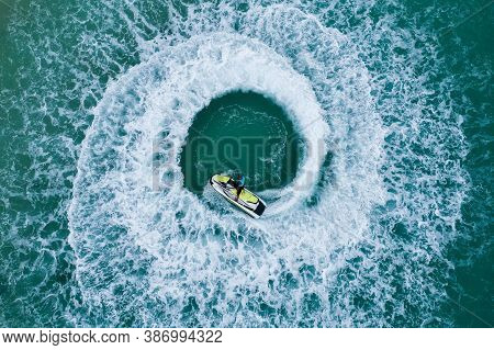 People Are Playing A Jet Ski In The Sea.aerial View. Top View.amazing Nature Background. The Color O