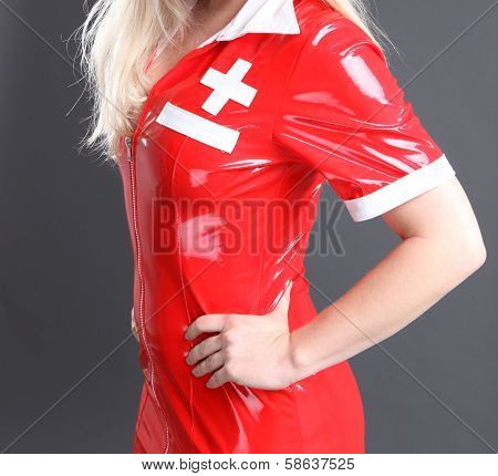 Sexy red fetish dress in studio shot