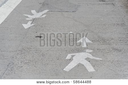 Man Crossing Road Symbol.