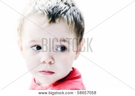 Little Boy Looking Out The Corner Of His Eye