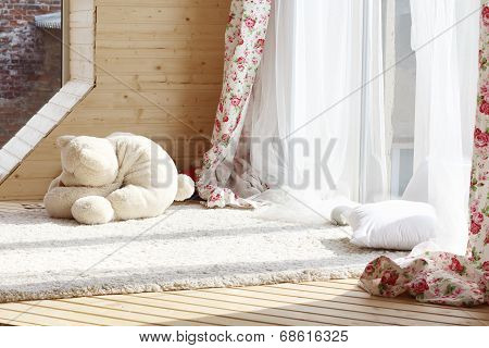 Sunlight From Windows With White Curtains, Fluffy Carpet And Soft Toy On Wooden Floor