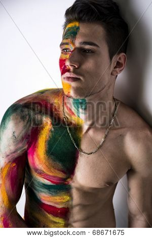 Attractive Young Man Shirtless, Skin Painted All Over With Colors