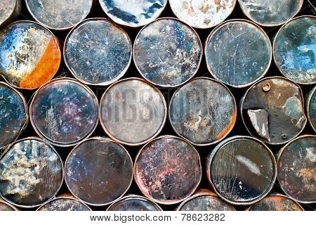 Side view of a stack of used oil drums