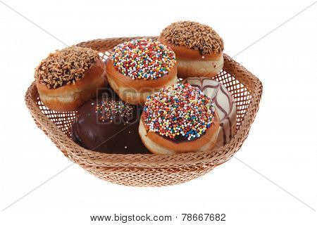 traditional jewish holiday chanuka donuts covered by dark chocolate on retro vintage basket isolated on white background