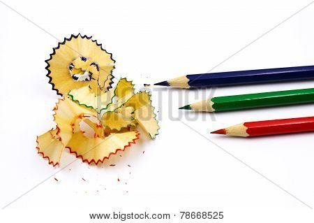 Colored Pencil With Colorful Pencil Shavings On White Background