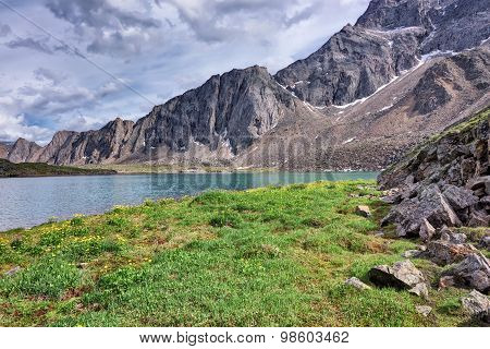 The Meadow On The Shore Of A Mountain Lake