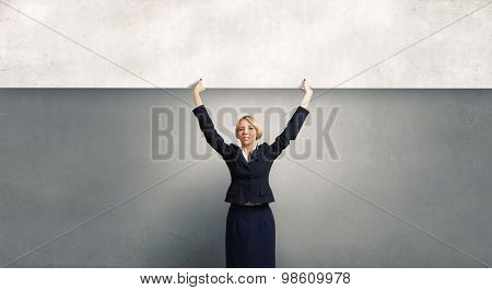 Yoiung pretty woman holding blank banner with place for text