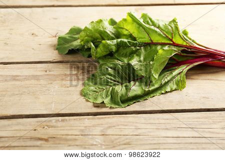 Fresh swiss chard on wooden table, close up