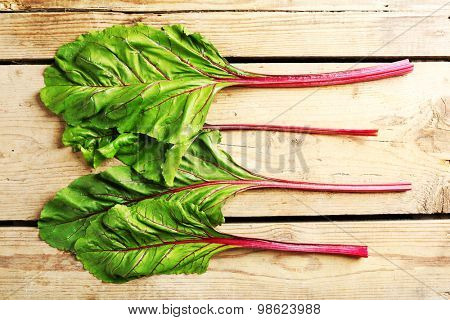 Fresh swiss chard on wooden table, close up