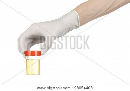 Medical Theme: Doctor's Hand In White Gloves Holding A Transparent Container With The Analysis Of Ur