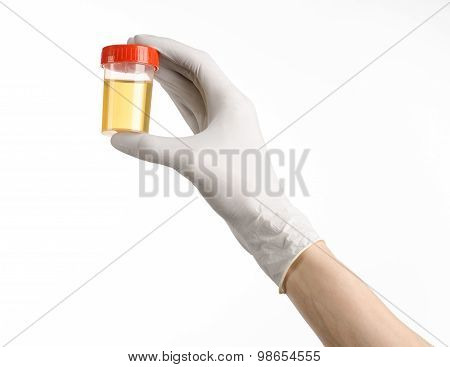Medical Theme: Doctor's Hand In White Gloves Holding A Transparent Container With The Analysis Of Ur