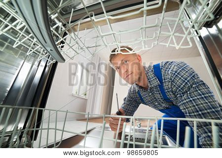 Technician Repairing Dishwasher