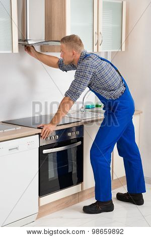 Handyman Fixing Kitchen Extractor Fan