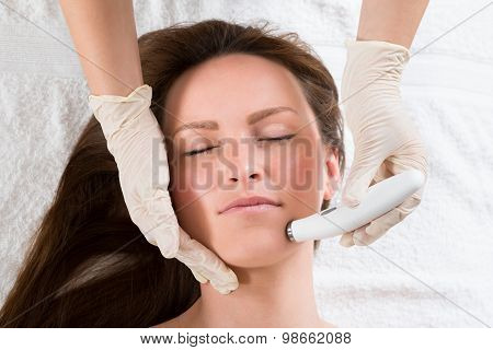 Woman Receiving Microdermabrasion Therapy