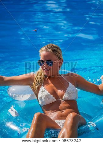 Top view of a  girl in the swimming pool
