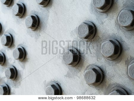 Gray Metal Surface With Hexagonal Bolt Heads