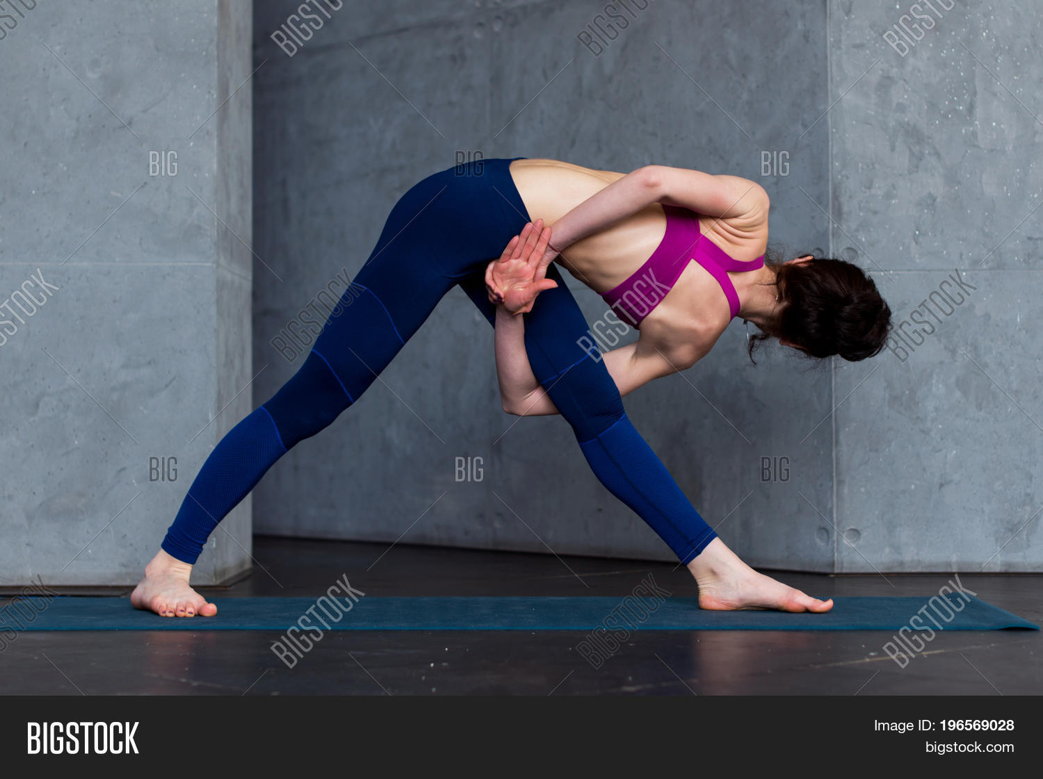 ...baddha utthita parsvakonasana, while practicing yoga indoors. 