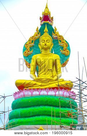 The beautiful lord buddha with king of naga (Pra jao yai sam phob) at Wat Mongkolgowitharam (Wat Huai Wang Nong)UbonratchathaniThailand.