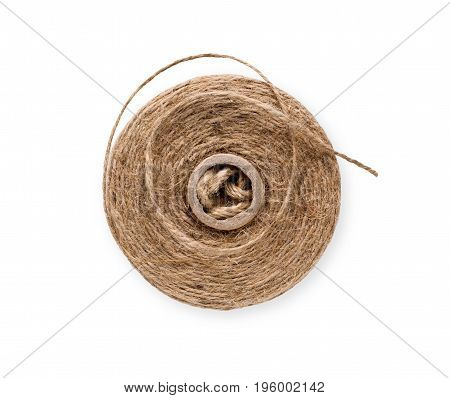 Coil of natural rope on white background. Close-up of twisted jute twine. Ecological handmade or gardening tool