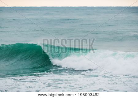 Blue wave in ocean, barrel wave. Swell in ocean