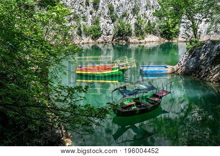 Old boats docked in the small bay at Matka Canyon, Skopje, Macedonia