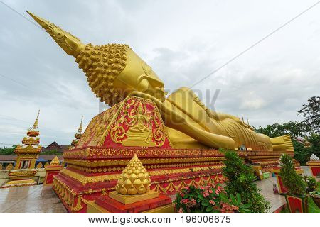 Reclining Buddha statue at Wat Pha That Luang Vientiane Laos.