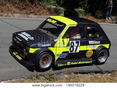 Malvaro Favale Italy - July 16 2017: Uphill Race Race Favale Castello: The Fiat 126 motorized kawasaki prototype led by Simone Bugatto in action on the route.