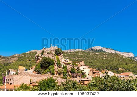 The Mountain Town Of Pratdip In Spain. Copy Space For Text. Isolated On Blue Background.