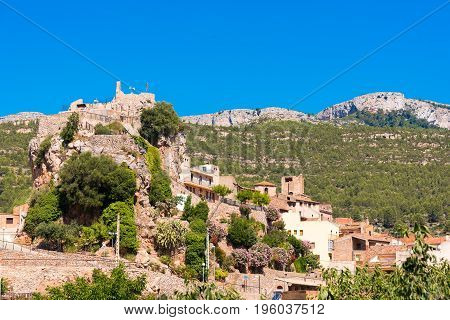 The Mountain Town Of Pratdip In Spain. Copy Space For Text. Isolated On Blue Background.