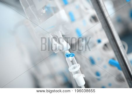 Drip bag in the hospital ward on the background of equipment.