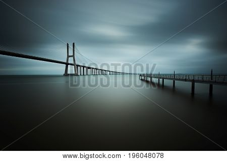 Vasco da Gama bridge in Lisbon, Portugal on a cloudy day