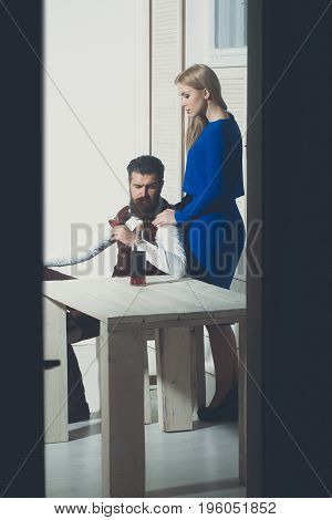 Girl Standing At Man Drinking Wine