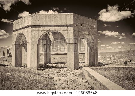concrete ruins of one of five reduction plants and pump stations manufacturing potash during World War I near Antioch, Nebraska, sepia toned image