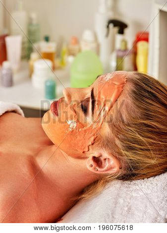Collagen face mask. Facial skin treatment. Face of woman receiving cosmetic procedure in beauty salon close up isolated. Special mask for the skin, against acne.