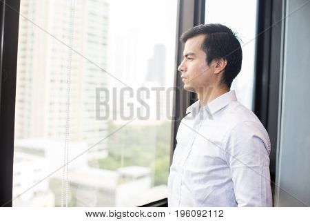 Businessman Standing And Looking To The City At Office Portrait Business Concept 20-30 Year Old.