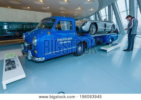 STUTTGART GERMANY- MARCH 19 2016: The high-speed racing car transporter Mercedes-Benz (Blue Wonder) and racing sports car Mercedes-Benz 300 SLR on the trailer 1955. Mercedes-Benz Museum.