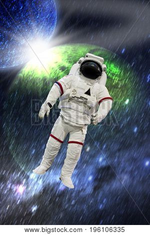 Astronaut wearing pressure suit in a space background
